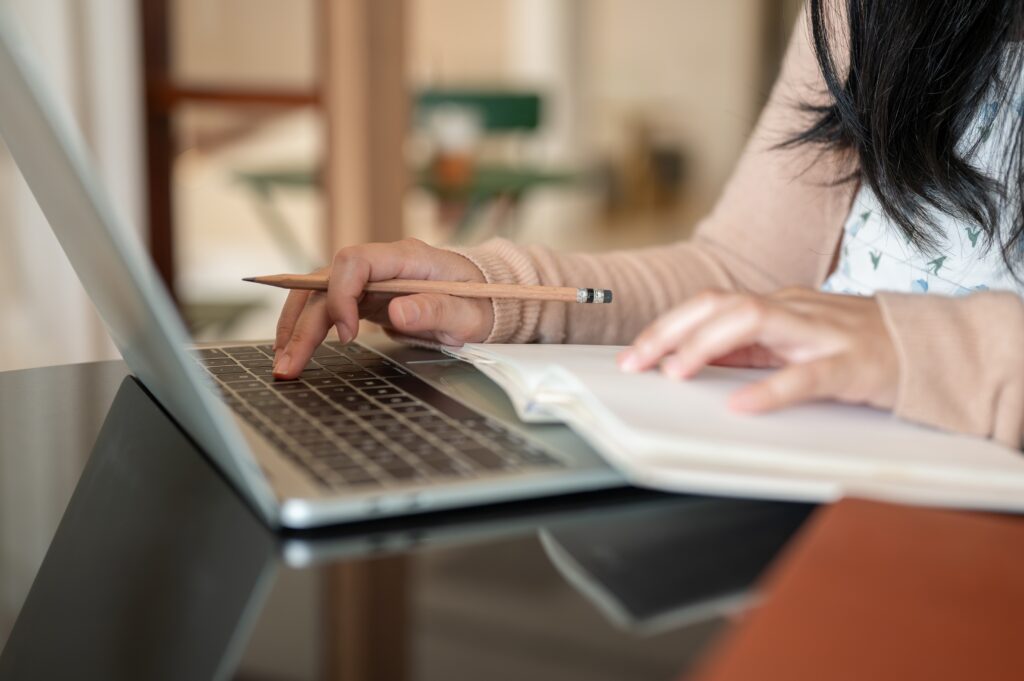 a,cropped,image,of,a,woman,working,on,her,laptop