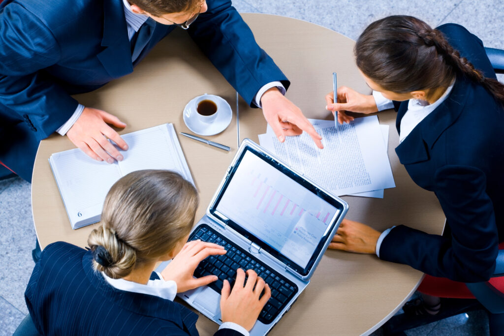 image,of,three,business,people,working,at,meeting